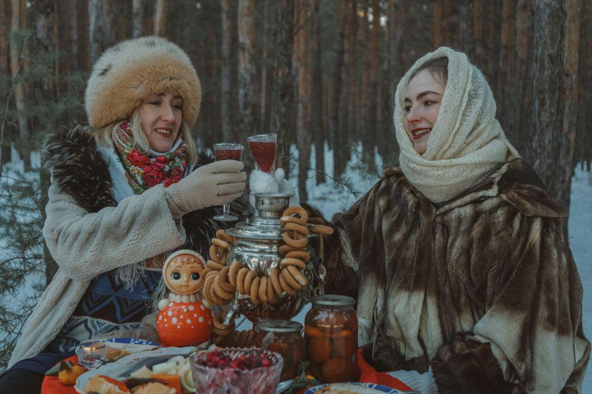 women eating local kazakh food in snowy weather