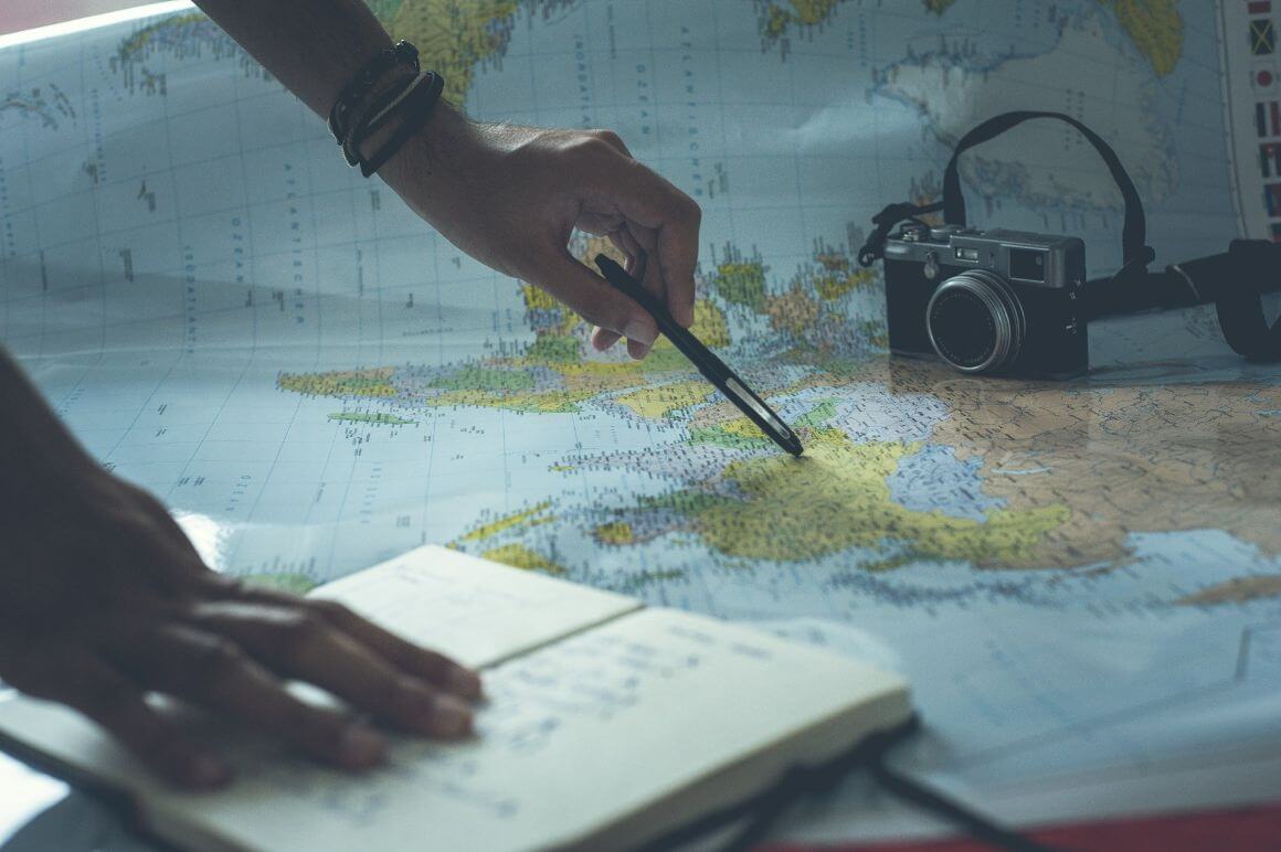 pointing on a map with ballpen
