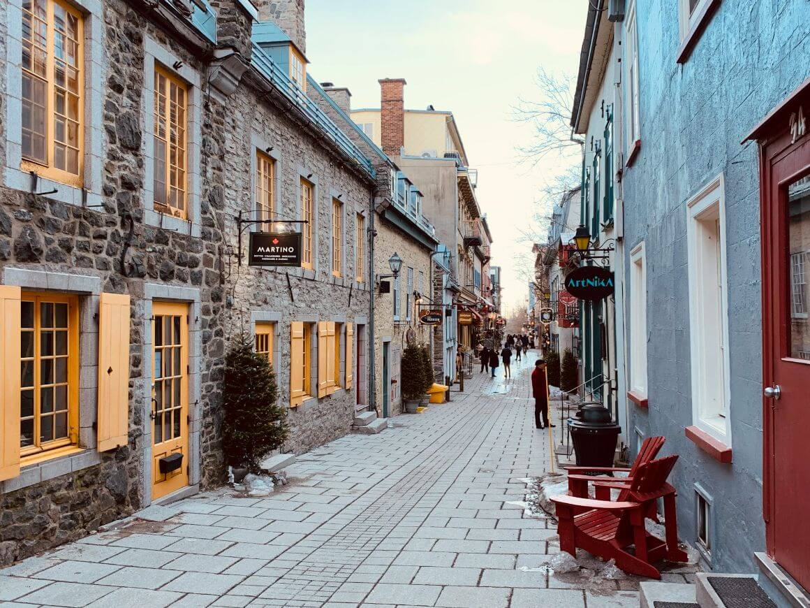cobblestone street lined with stone buildings