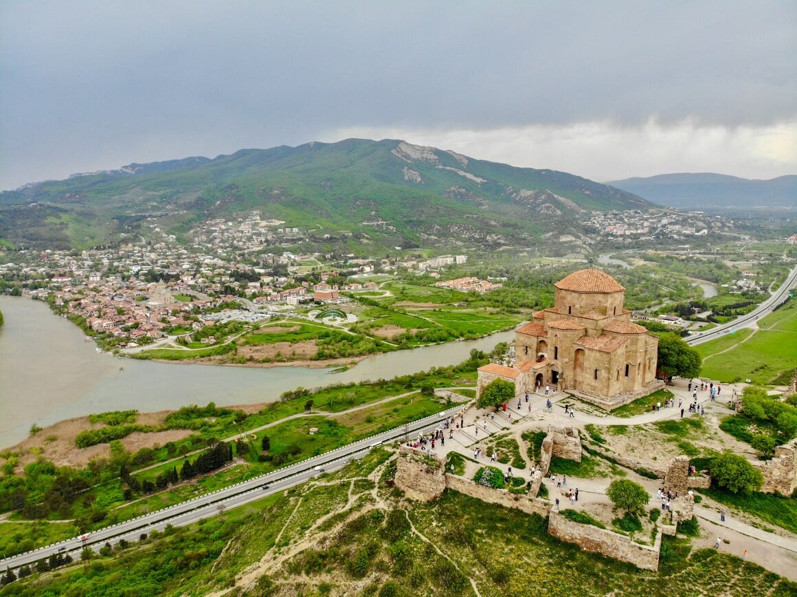 an old monastery sat amongst lush greenery in Mtskheta georgia
