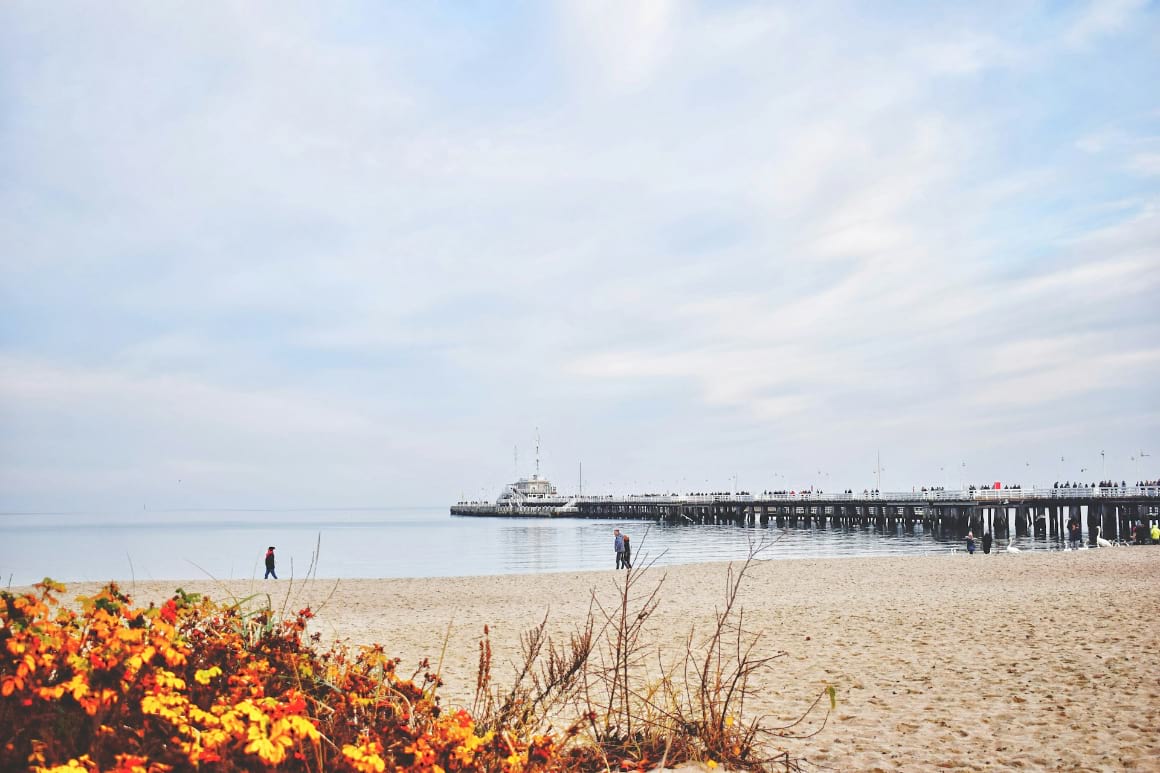 beach with a pier in sopot poland