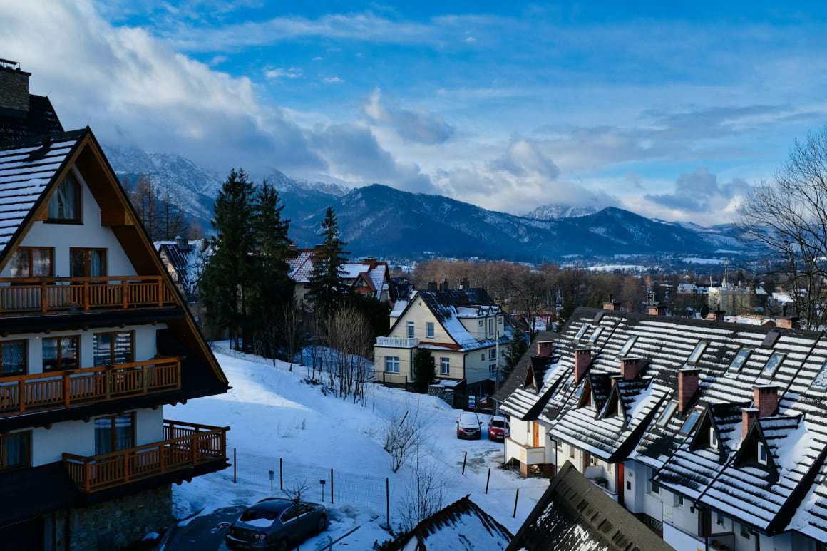 brown and white wooden houses zakopane poland