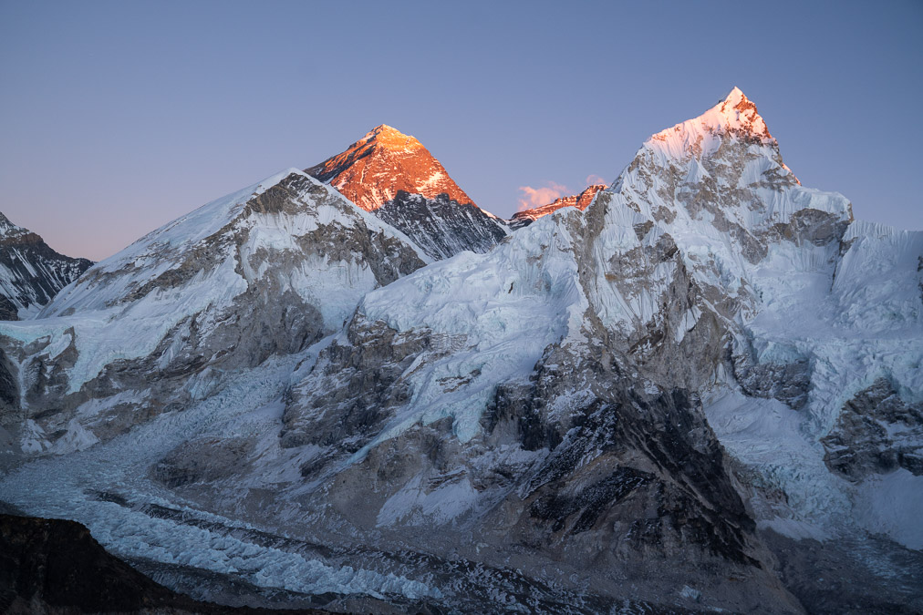 mount everest in nepal bathed in golden light at sunset as seen from kala patthar peak