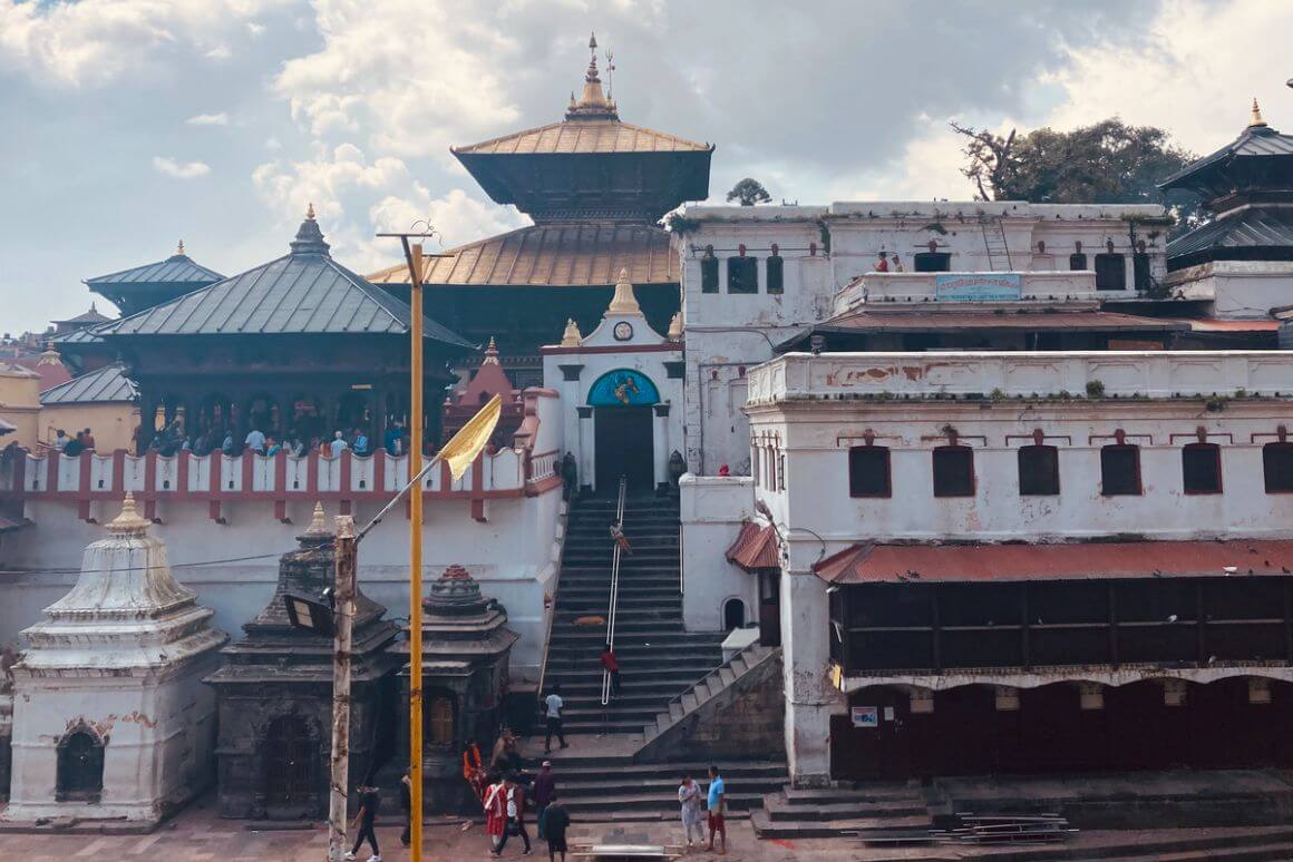 temple complex with multiple people looking around