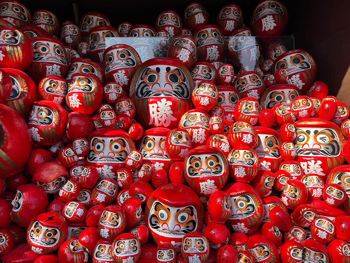 A collection of red darumas at Katsuo-ji temple in Osaka, Japan