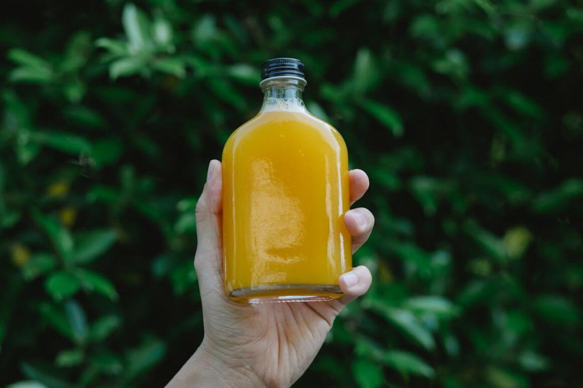 bottle of orange juice in a jar
