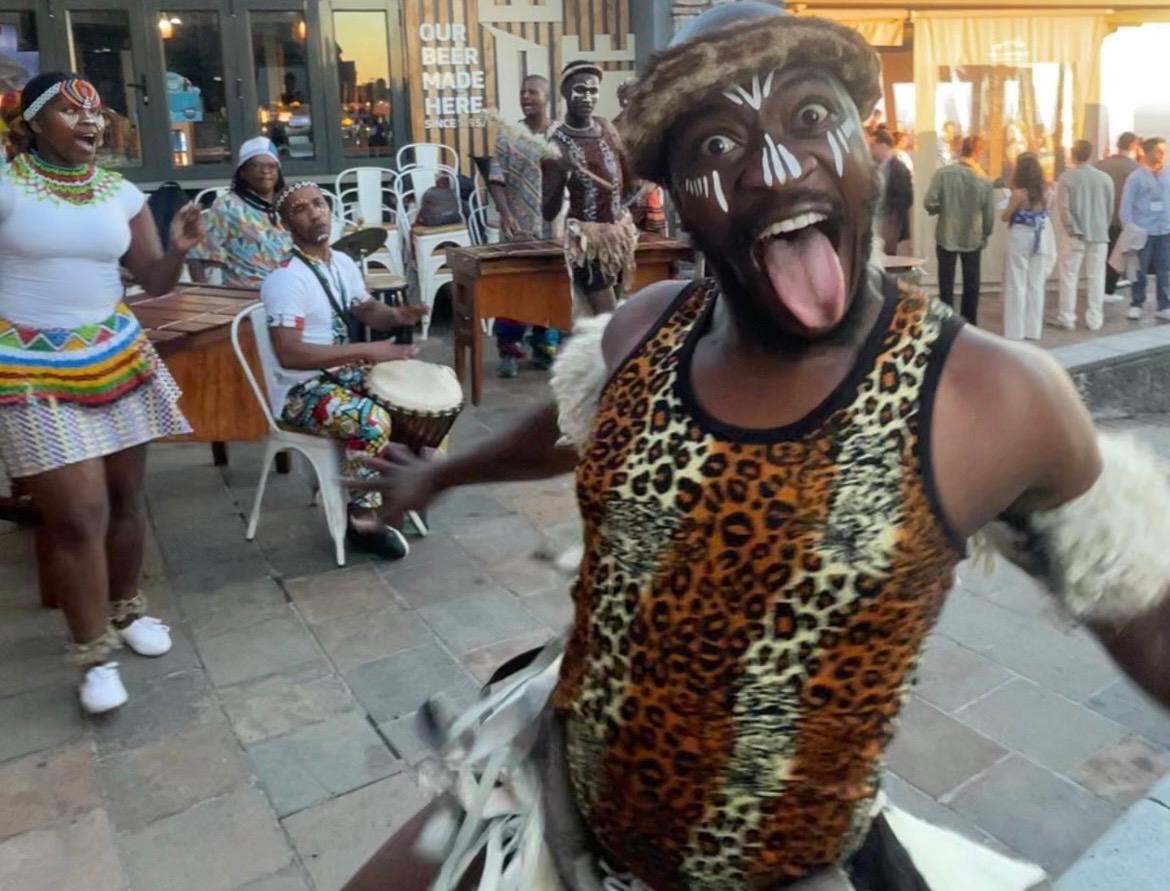A traditional African dancer performs at the top of Table Mountain in Cape Town, South Africa.