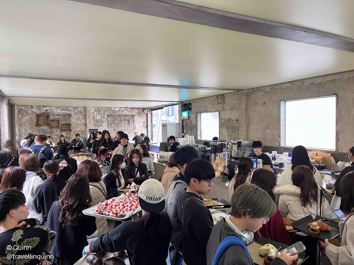 local cafe full of costumers in queue