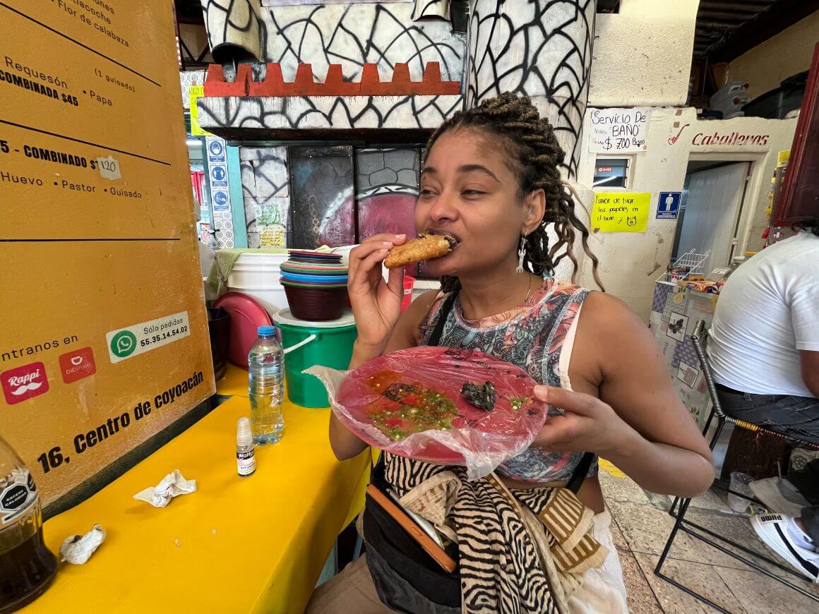 traveller eating local mexican snack