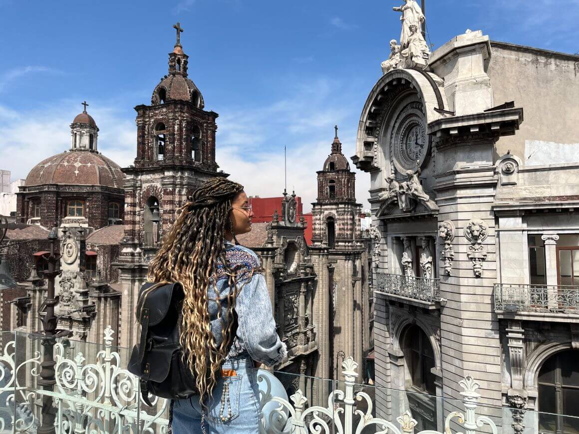 female traveller at the terrace overlooking historic center