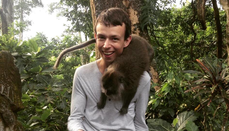 Alex with a monkey at the Ubud Monkey Forest in Bali, Indonesia.