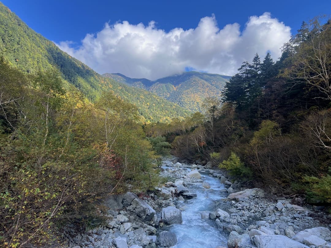 views of a river and valley in kamikochi national park, japanese alps