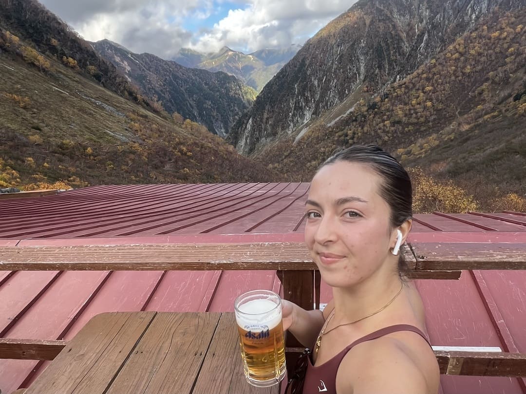 taya having a beer at karasawa hutte, japan