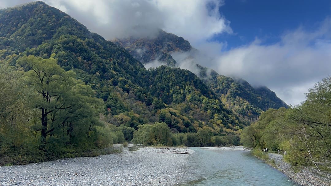 a river running through kamikochi national park, japan