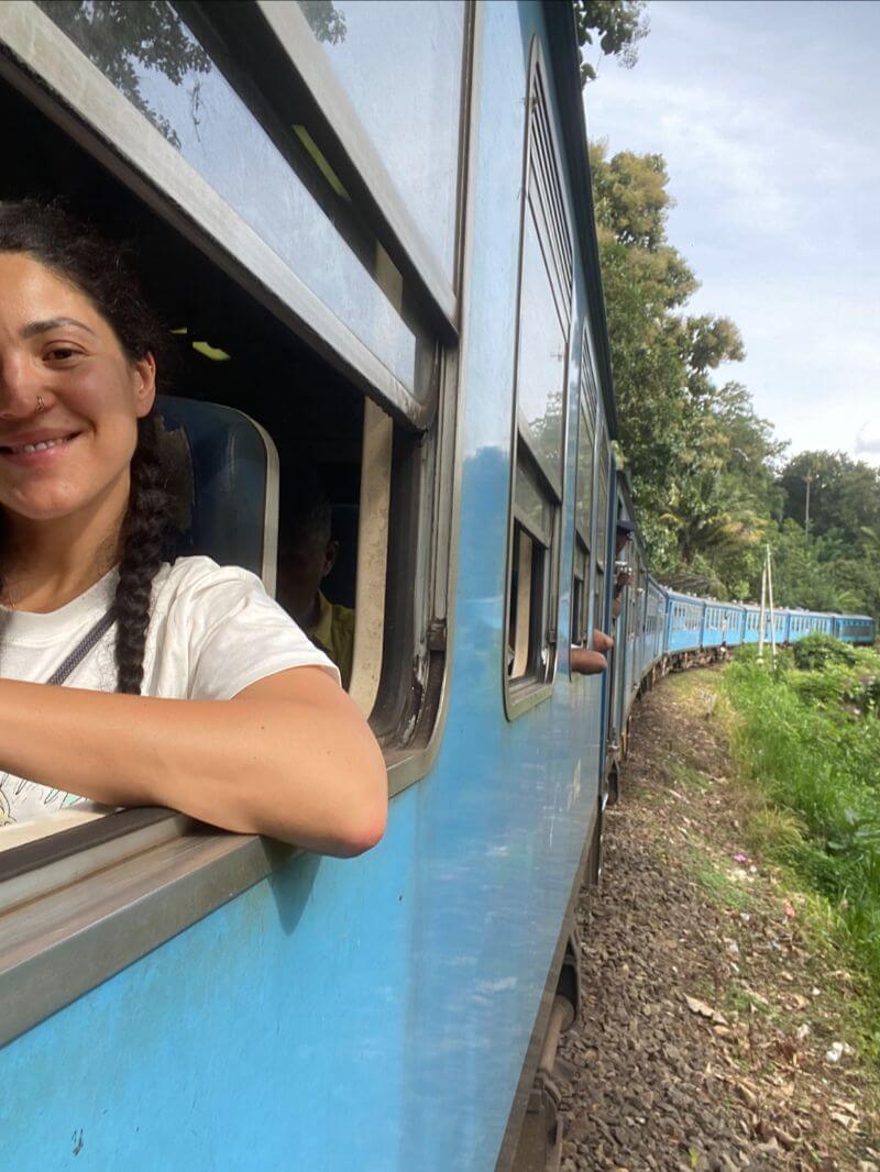 female traveler taking selfie on kandy to ella train