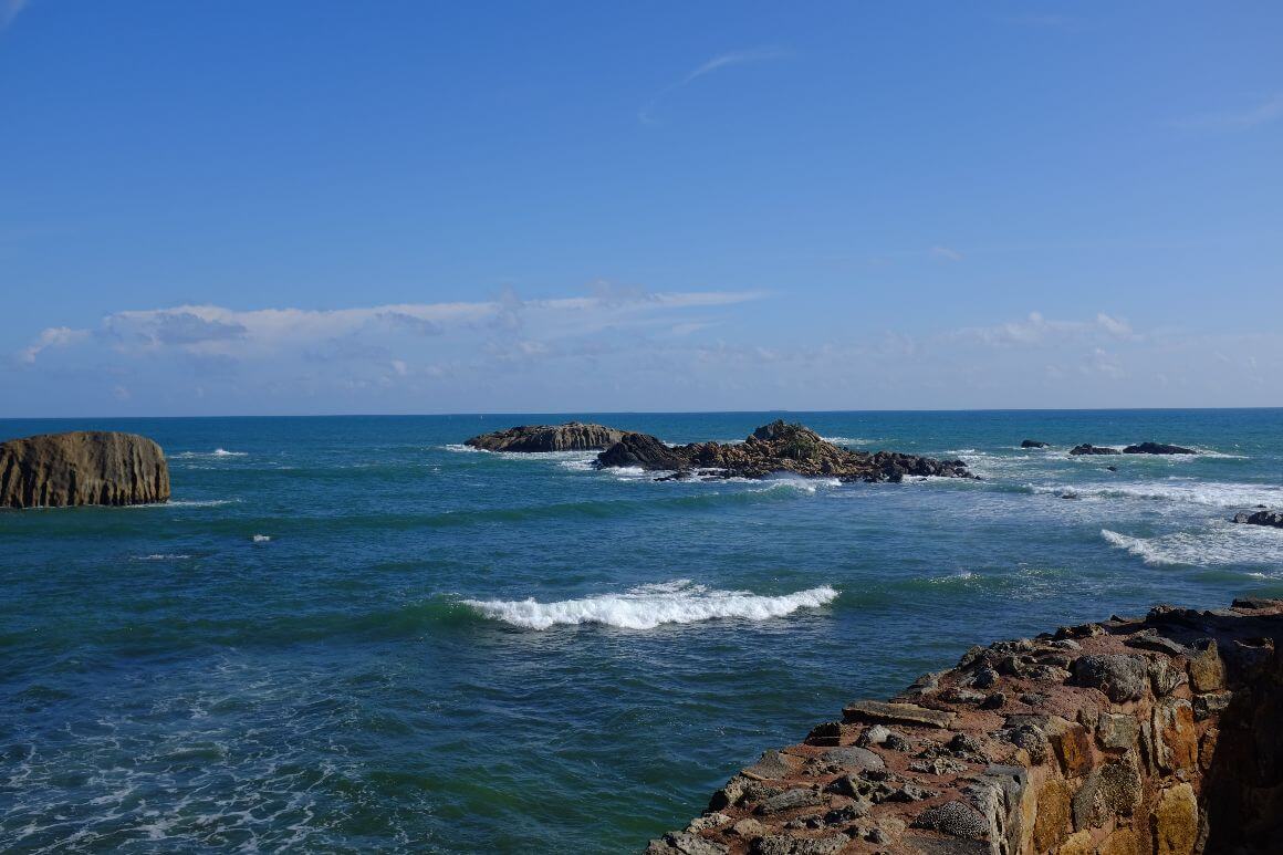rocky coast with clear blue sea