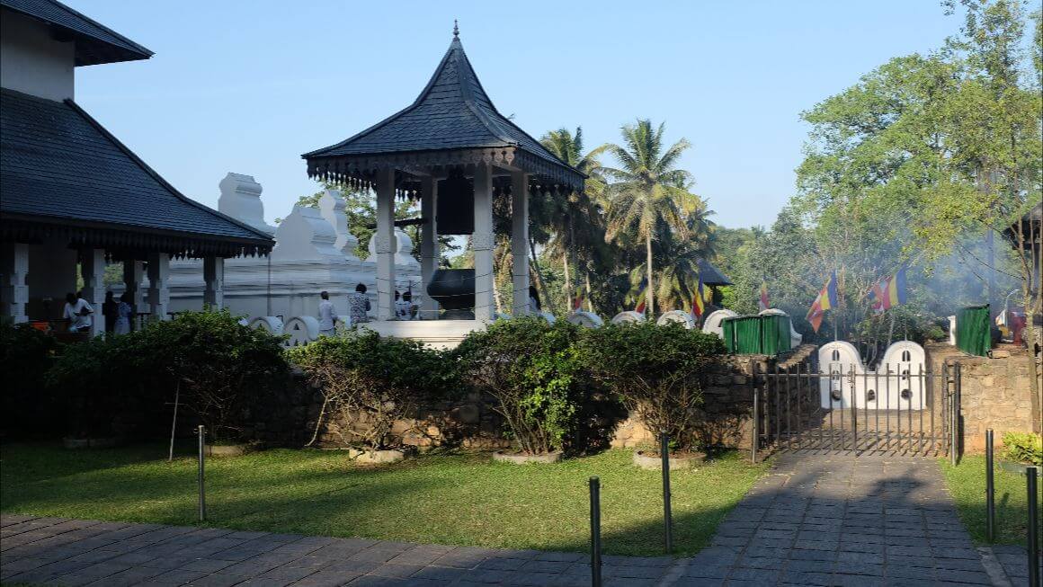 small temple structure housing a big bell