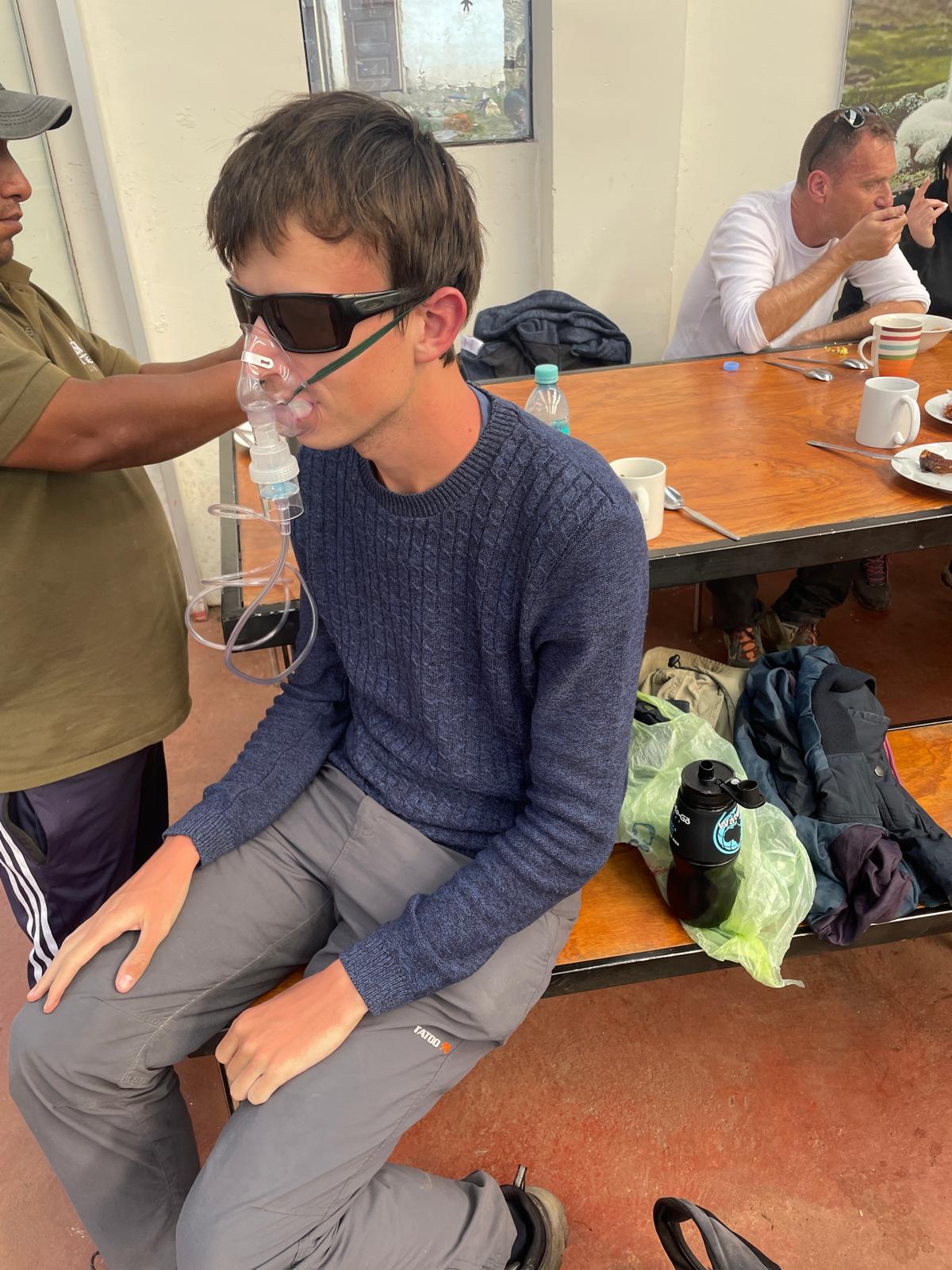 Alex on oxygen after a brutal hike through the mountains in Ausangate, Peru.