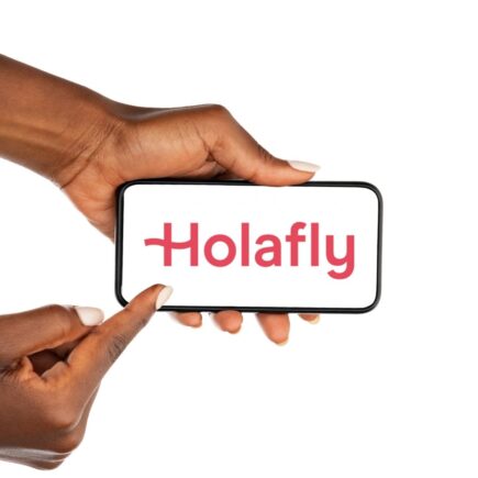 mockup of a person holding a smartphone in white background with Holafly logo