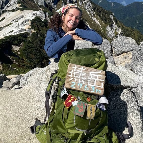 audy on top of a mountain in japan with the osprey aether