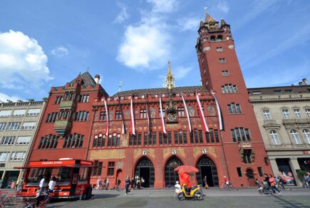 The impressive red and decorative exterior of the town hall (rathaus) in Basel, Switzerland