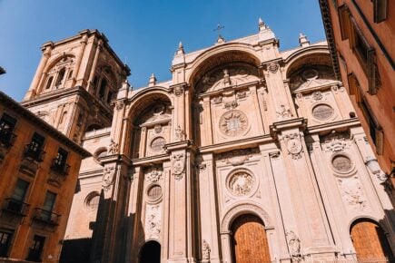 Looking up at the imposing main entrance of Granada cathedral, Granada, Spain