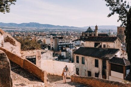 The view down over Granada, Spain including the mountains beyond.