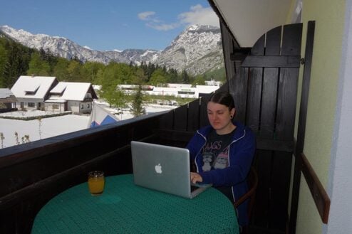 Nic working on a laptop in Bohinj, near Bled in Slovenia.