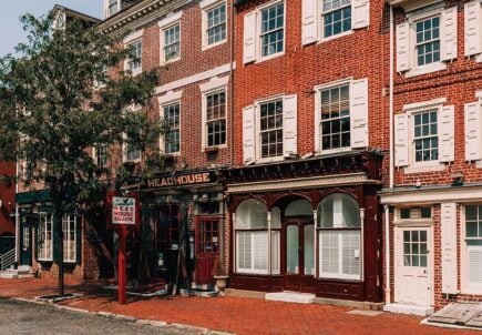 A pub on an old street and red brick buildings in Philadelphia, United States of America.