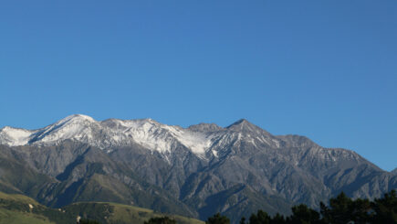 view of snow capped mountains in the south island of new zealand