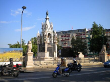 geneva old town monument with scooters